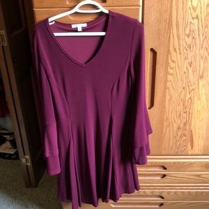 Burgundy, long sleeve sleeve is doubled at the end with a flair